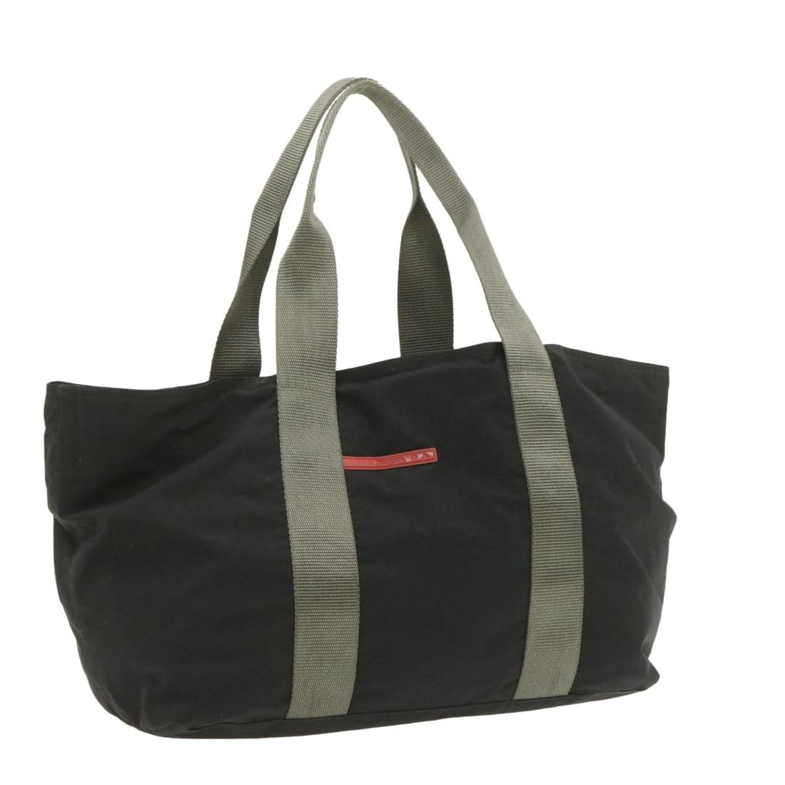 Authentic PRADA Sports Nylon Tote Bag Black: Brand: PRADA Style: Tote Bag Material: Nylon Color: Black Made In: - Size (Inches): W14.17 x H9.84 x D5.9inch(Approx) Exterior Condition: Nylon : lose shape rubbing stain Handle : slight