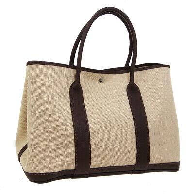 Authentic HERMES Hand Tote Bag: Brand: HERMES Model: Hand Tote Bag Country of Origin: France Material: Toile H Leather Color: Beige Dark Brown Size (Inch): W 14.2 x H 9.8 x D 6.7 " Handle Drop. 5.5 " Size (CM): W 36.0 x H 25.0 x D 1