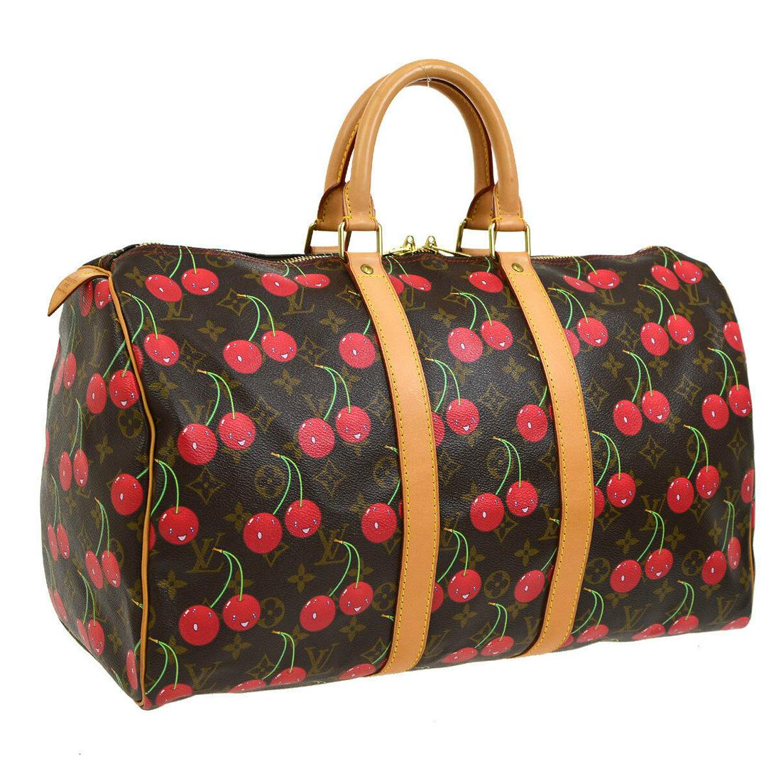 Authentic LOUIS VUITTON Travel Hand Bag: Brand: LOUIS VUITTON Model: Travel Hand Bag Country of Origin: France Material: Monogram Cherry Canvas Leather Color: Brown Red Size (Inch): W 17.7 x H 10.0 x D 8.1 " Handle Drop. 4.3 " Size (CM): W 4