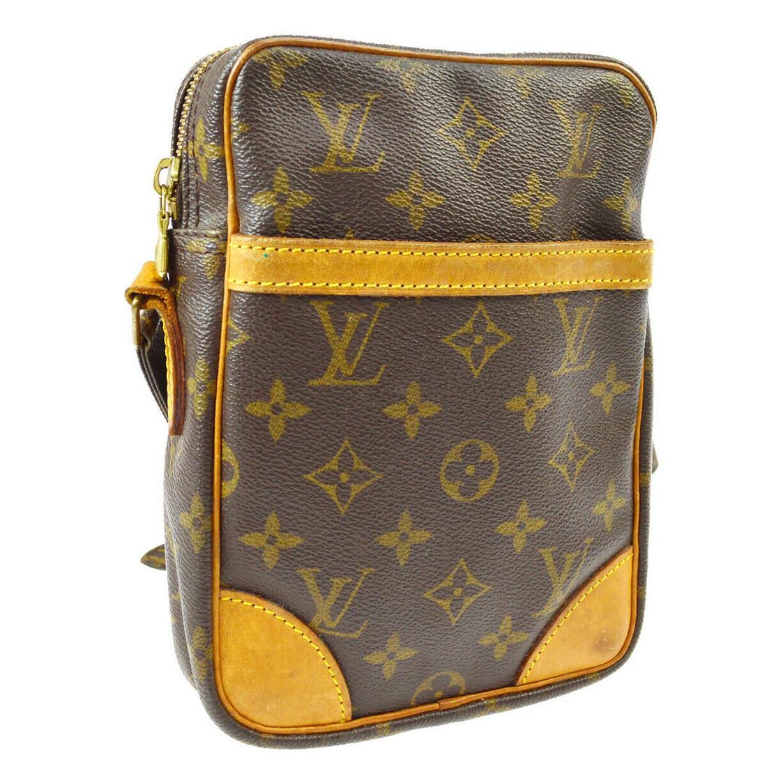 Authentic LOUIS VUITTON DANUBE: Brand: LOUIS VUITTON Model: LOUIS VUITTON danube Country of Origin: France Material: Leather Color: Brown Size (Inch): W 5.9 x H 8.3 x D 1.8 " Strap Drop. 18.1 - 21.6 " Size (CM): W 15.0 x H 21.0 x D 