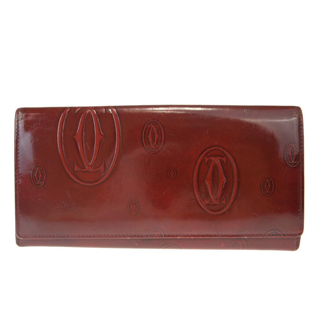 Authentic CARTIER Trifold: Brand: CARTIER Model: Trifold Country of Origin: Material: Leather Color: Bordeaux Size (Inch): W7.5X H3.5X D0" Size (CM): W19X H9X D0Cm All Bidhaus items come with a 100 % money-back authenticity gua