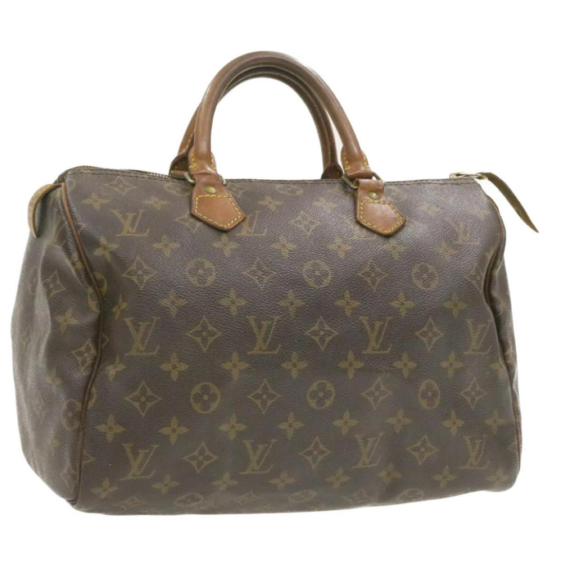 Authentic LOUIS VUITTON Monogram Speedy 30 Hand Bag LV: Brand: LOUIS VUITTON Style: Hand Bag Material: Monogram Canvas Color: Monogram Made In: France Size (Inches): W12 x H9 x D6.5"(Approx) Exterior Condition: Monogram Canvas : lose shape rubbing di