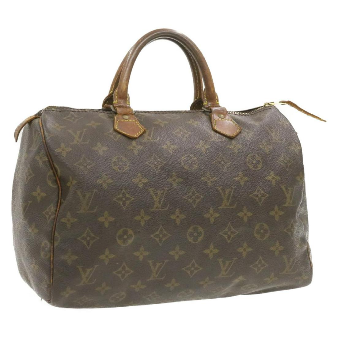Authentic LOUIS VUITTON Monogram Speedy 30 Hand Bag LV: Brand: LOUIS VUITTON Style: Hand Bag Material: Monogram Canvas Color: Monogram Made In: France Size (Inches): W12 x H9 x D6.5"(Approx) Exterior Condition: Monogram Canvas : lose shape rubbing di