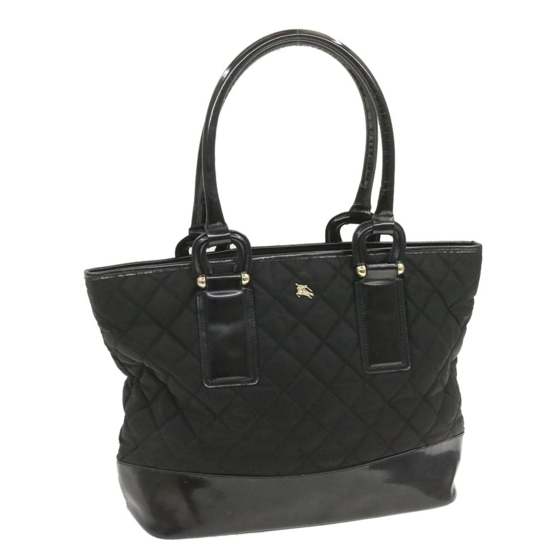 Authentic BURBERRY Established 1856 Nylon Tote Bag: Brand: BURBERRY Style: Tote Bag Material: Nylon Color: Black Made In: Italy Size (Inches): W17.71 x H11.81 x D6.29inch(Approx) Exterior Condition: Nylon : lose shape rubbing Leather : rub