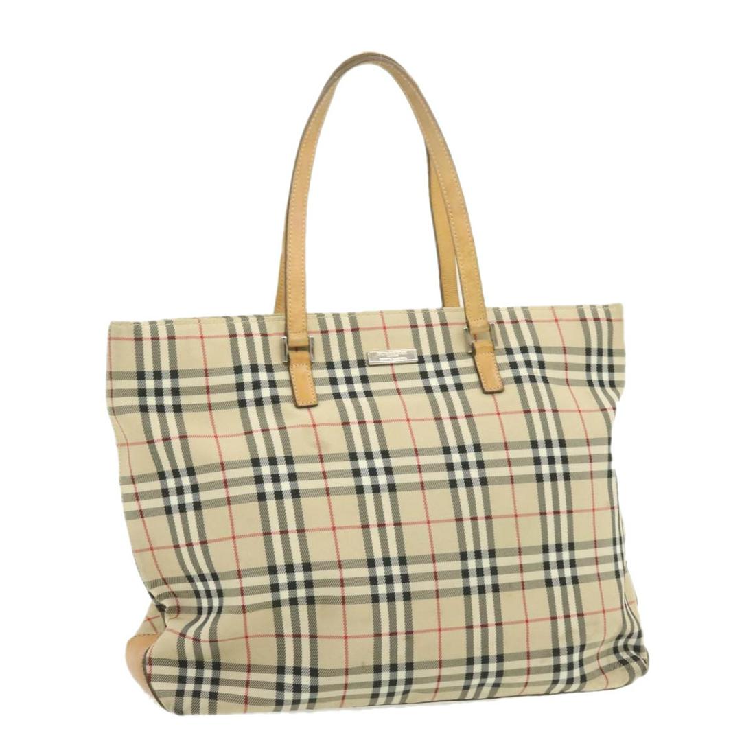 Authentic BURBERRY Blue Label Nova Check Tote Bag Nylon: Brand: BURBERRY Style: Tote Bag Material: Nylon Color: Beige Made In: Japan Size (Inches): W13.38 x H11.81 x D3.93inch / Shoulder Drop 6.69inch(Approx) Exterior Condition: Nylon : lose shape rubb