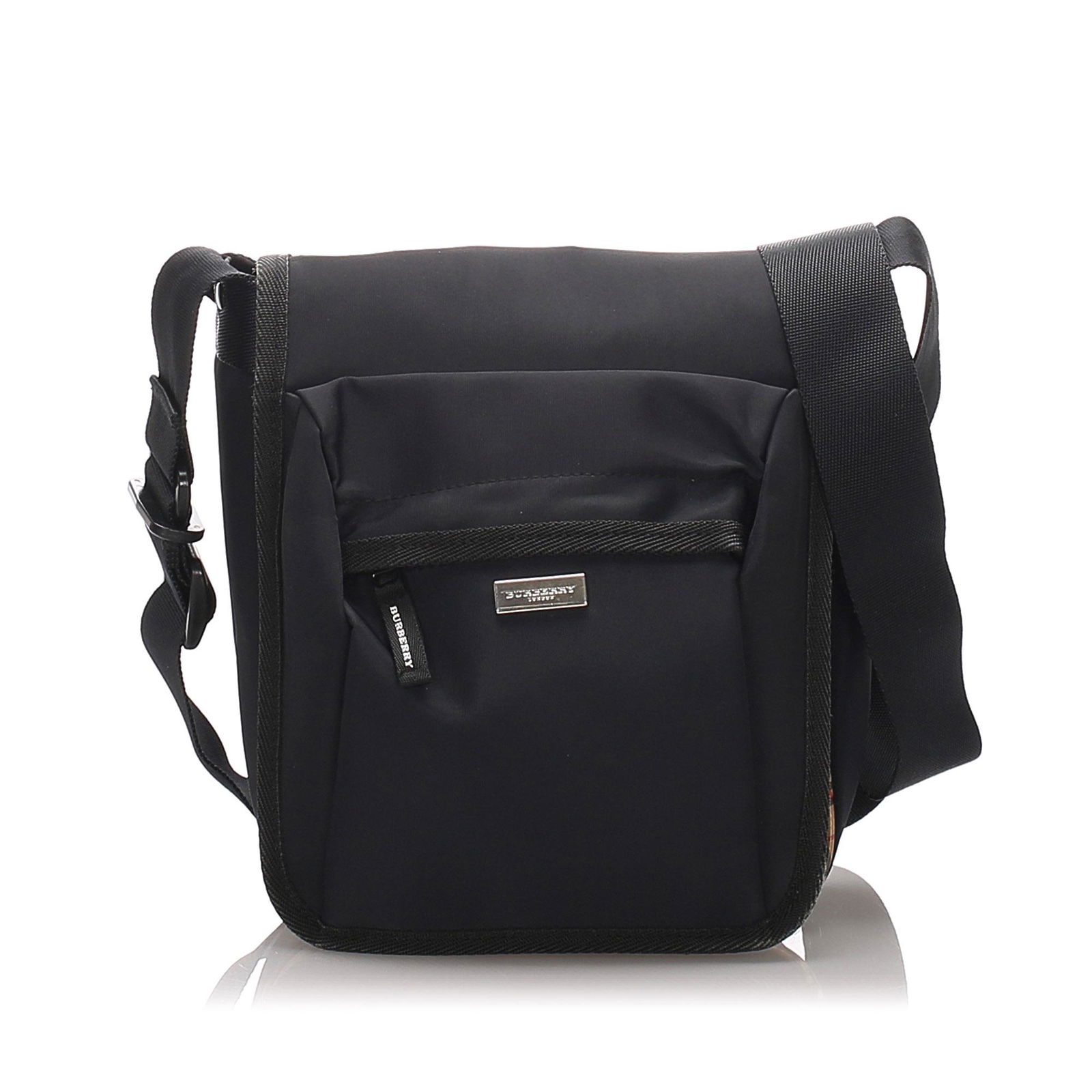 Authentic Burberry Nylon Crossbody Bag: This crossbody bag features a nylon body, a flat strap, a top flap and exterior zip pocket. Brand: Burberry Model: Nylon Crossbody Bag Origin: United Kingdom Category: Crossbody Bag Color: Black Style