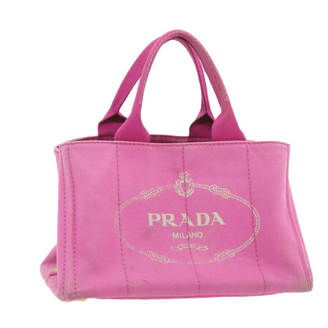 Authentic PRADA Canapa Hand Bag Pink Canvas: Brand: PRADA Style: Tote Bag Material: Canvas Color: Pink Made In: TURKEY Size (Inches): W13.77 x H8.66 x D9.05inch(Approx) Exterior Condition: Canvas : stain rubbing lose shape Handle :