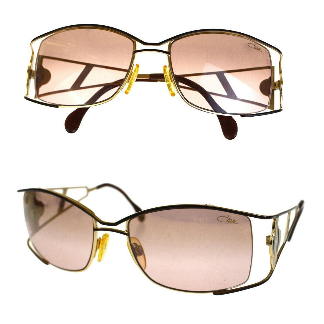 Authentic CAZAL Sunglasses: Brand: CAZAL Model: Sunglasses Country of Origin: Material: Plastic Color: Brown Size (Inch): W2X H1.6X D0" Size (CM): W5X H4X D0Cm All Bidhaus items come with a 100 % money-back authenticity guarante