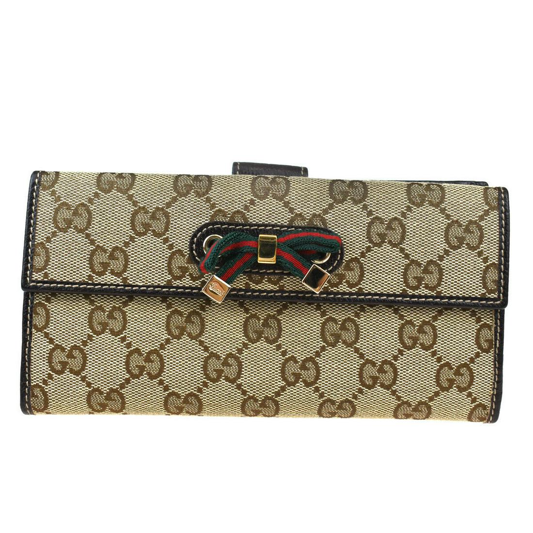 Authentic GUCCI Bifold: Brand: GUCCI Model: Bifold Country of Origin: Italy Material: PVC Leather Color: Brown Purple Size (Inch): W7.5X H3.5X D0.8" Size (CM): W19X H9X D2Cm All Bidhaus items come with a 100 % money-back aut