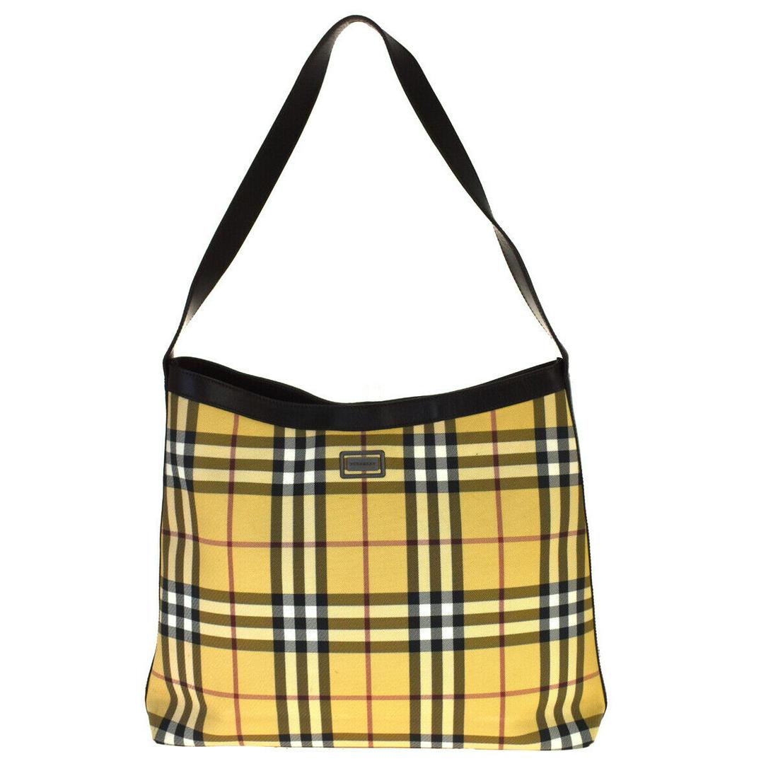 Authentic BURBERRY Shoulder Bag: Brand: BURBERRY Model: Shoulder Bag Country of Origin: Material: PVC Leather Color: brown Beige Size (Inch): W13.4X H11X D3.1" Size (CM): W34X H28X D8Cm All Bidhaus items come with a 100 % money-back