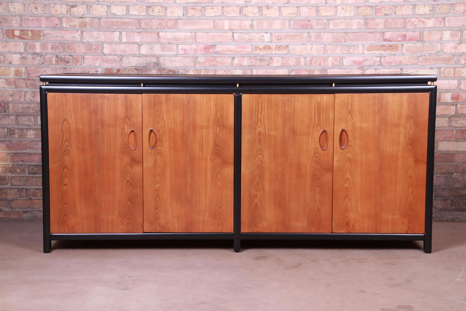 Authentic Michael Taylor for Baker New World Collection: An exceptional mid-century modern Hollywood Regency Chinoiserie sideboard credenza or bar cabinet By Michael Taylor for Baker Furniture "New World Collection" USA 1950s Cherry wood with black lacquere