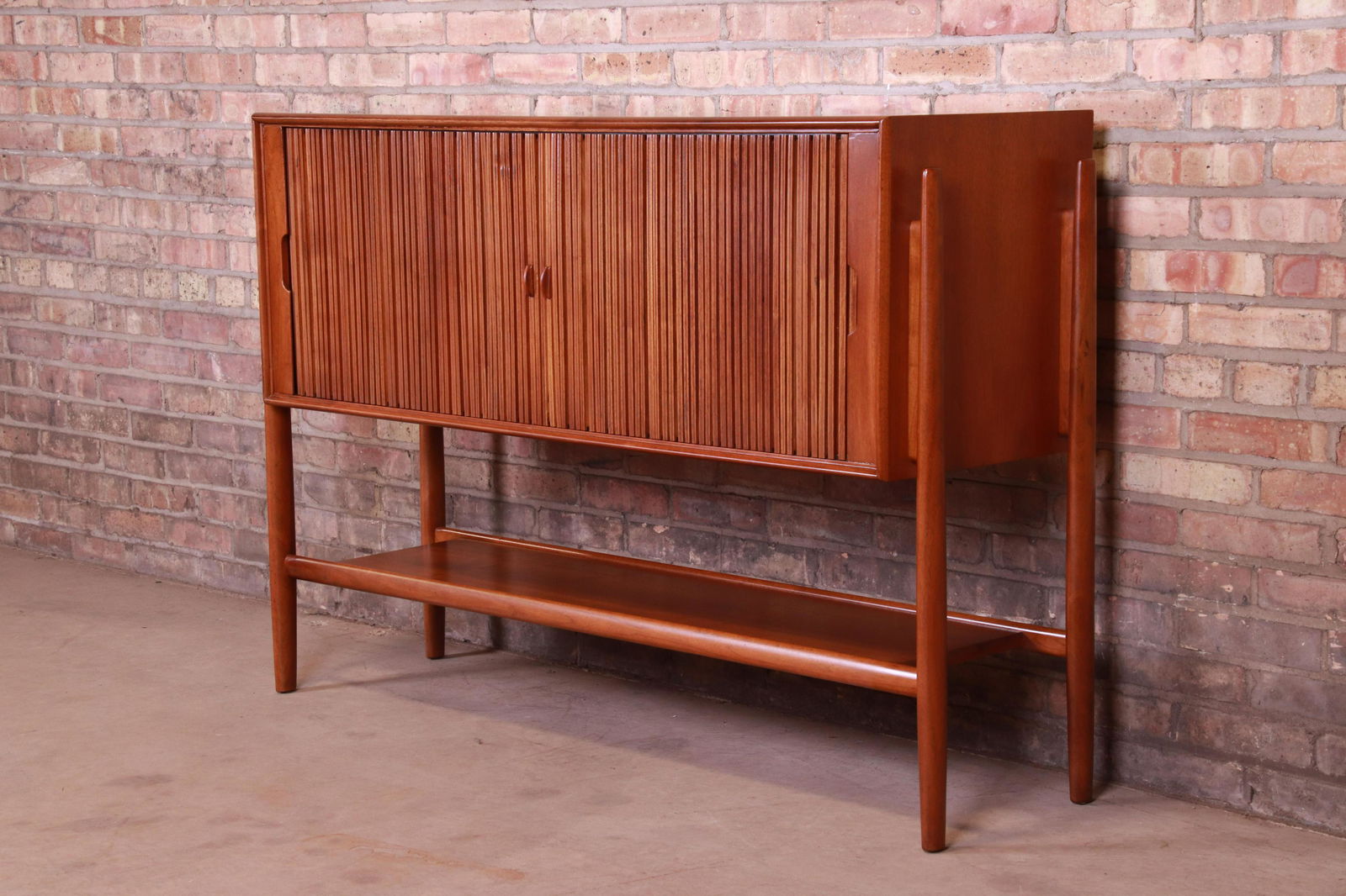 Authentic Barney Flagg for Drexel Parallel Walnut: An exceptional mid-century modern walnut tambour door sideboard credenza or bar cabinet Featuring sleek Danish-inspired design similar to pieces by Arne Vodder and Finn Juhl By Barney Flagg for Drexel