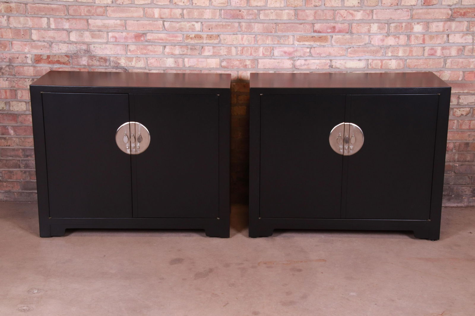 Authentic Michael Taylor for Baker Far East Collection: An exceptional pair of mid-century modern Hollywood Regency Chinoiserie compact credenzas sideboard buffets or bar cabinets By Michael Taylor for Baker Furniture "Far East Collection" USA 1950s Black