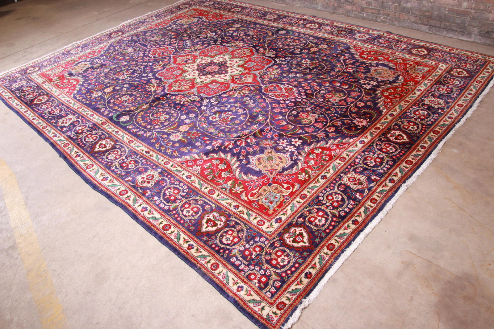 Authentic Hand Knotted Persian Tabriz Area Rug - 9'9" X: A gorgeous vintage hand knotted Persian Tabriz wool area rug Late 20th Century Classic design with floral sprays and bouquets in a rich royal blue field with red green cream and pink accents. Measures