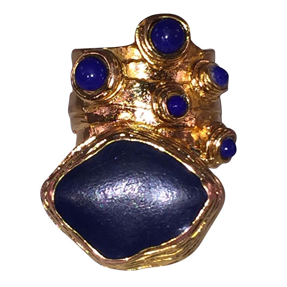 Authentic YVES SAINT LAURENT Arts and Crafts Inspired: Brand: YVES SAINT LAURENT Style: Cocktail Fantastic statement ring by the House of Yves Saint Laurent.18 kt gold plated over costume metal with simulated blue lapis lazuli glass and enamel.The ring fa