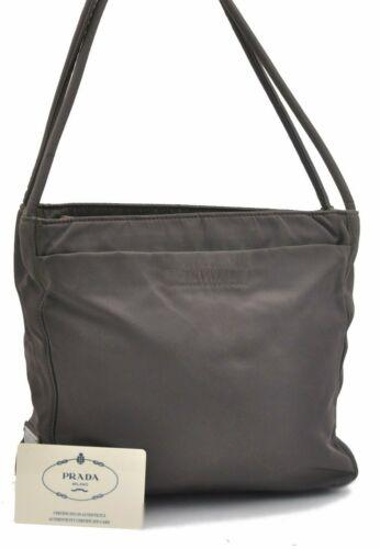 Authentic PRADA Shoulder Bag: Brand: PRADA Model: Shoulder Bag Country of Origin: Italy Material: Nylon Color: Khaki Bag Length: 9.1inches (23cm) Bag Height: 8.3inches (21cm) Bag Depth: 2.8inches (7cm) All Bidhaus items come with 