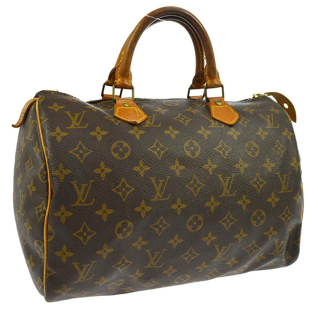 Authentic LOUIS VUITTON Monogram Hand Bag: Brand: LOUIS VUITTON Model: Monogram Hand Bag Country of Origin: France Material: Canvas Color: Brown Size (Inch): W 12.2 x H 8.3 x D 7.1 " Handle Drop. 3.5 " Size (CM): W 31.0 x H 21.0 x D 18.0 cm Ha
