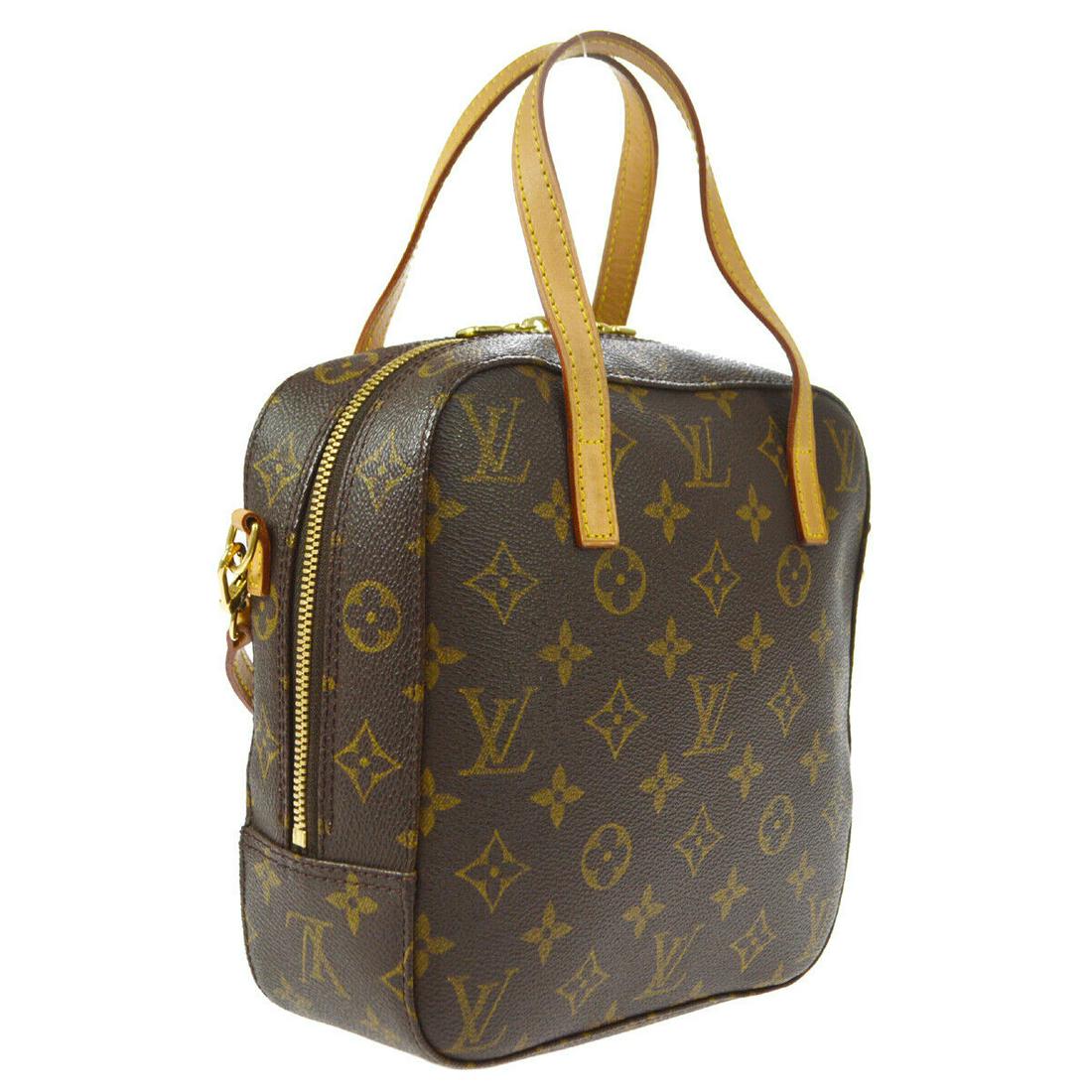 Authentic LOUIS VUITTON Monogram Double Handles: Brand: LOUIS VUITTON Model: Monogram Double Handles Country of Origin: France Material: Leather Color: Brown Size (Inch): W 7.7 x H 7.9 x D 3.1 " Handle Drop. 3.9 " Strap Drop. 20.5 " Size (CM): W 19.