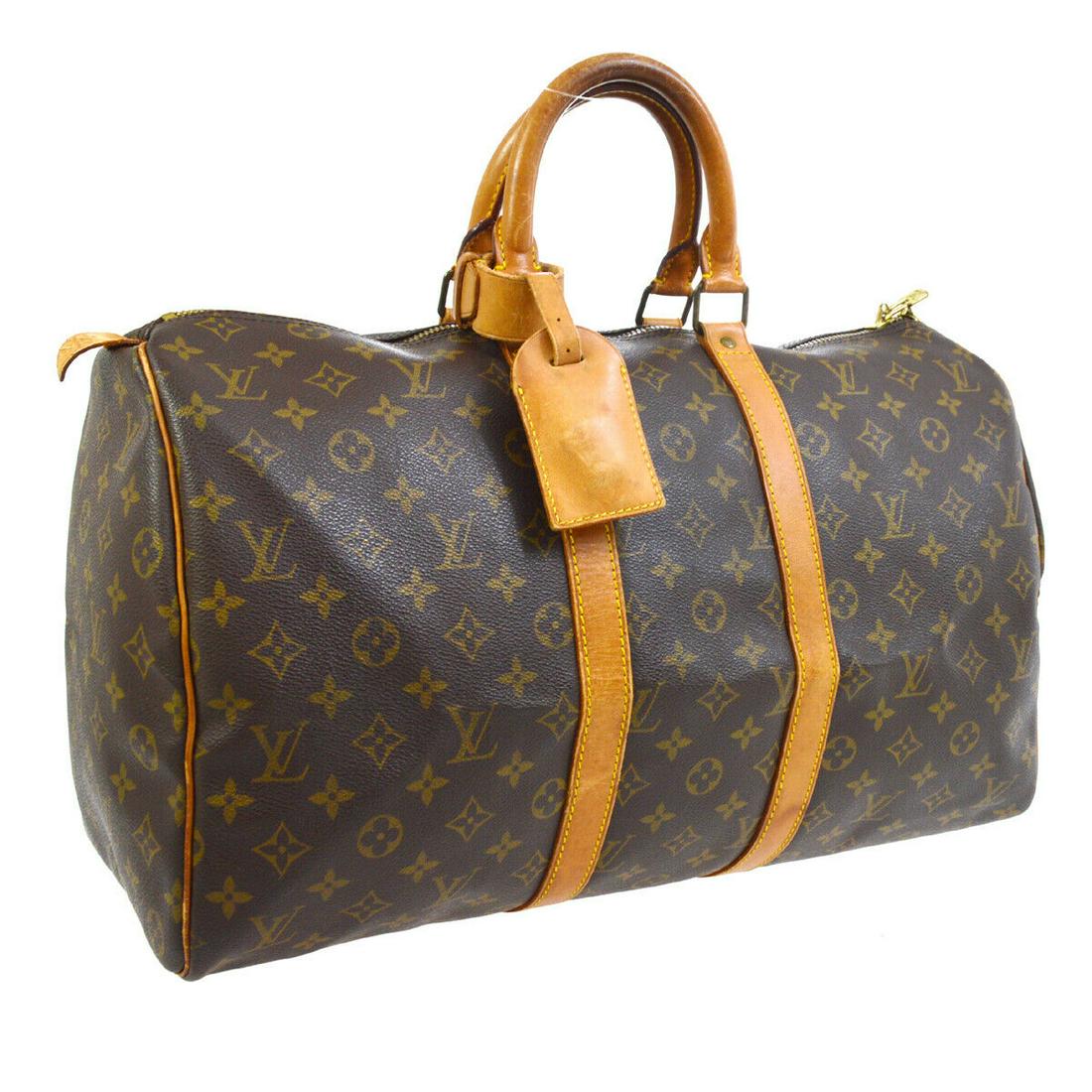Authentic LOUIS VUITTON Keepall 45 Double Handles: Brand: LOUIS VUITTON Model: Keepall 45 Double Handles Country of Origin: France Material: Canvas Color: Brown Size (Inch): W 17.7 x H 11.0 x D 7.9 " Handle Drop. 4.3 " Size (CM): W 45.0 x H 28.0 x D 2