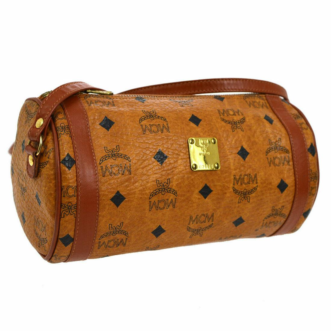 Authentic MCM Cross Body: Brand: MCM Model: Cross Body Country of Origin: Italy Material: Leather Color: Brown Black Size (Inch): W 9.1 x H 4.7 x D 4.9 " Strap Drop. 20.5 - 24.0 " Size (CM): W 23.0 x H 12.0 x D 12.5 cm Strap D