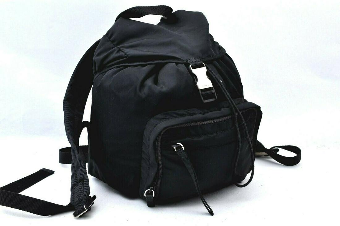 Authentic PRADA Backpack: Brand: PRADA Model: Backpack Country of Origin: Italy Material: Nylon Color: Black Bag Length: 9.1inches (23cm) Bag Height: 10.4inches (26.5cm) Bag Depth: 6.1inches (15.5cm) All Bidhaus items come wit