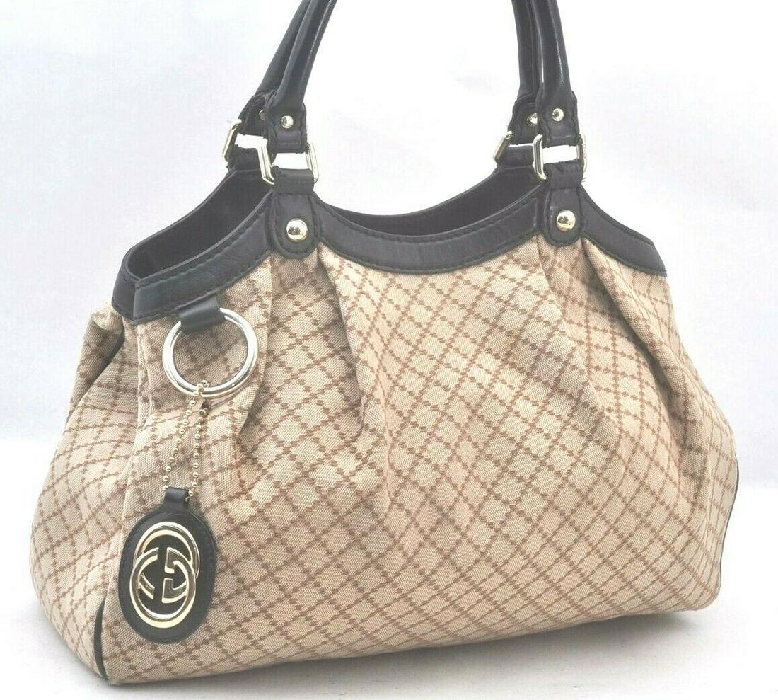 Authentic GUCCI Hand Bag: Brand: GUCCI Model: Hand Bag Country of Origin: Italy Material: Canvas Color: Beige Bag Length: 13.2inches (33.5cm) Bag Height: 11inches (28cm) Bag Depth: 4.5inches (11.5cm) All Bidhaus items come wit