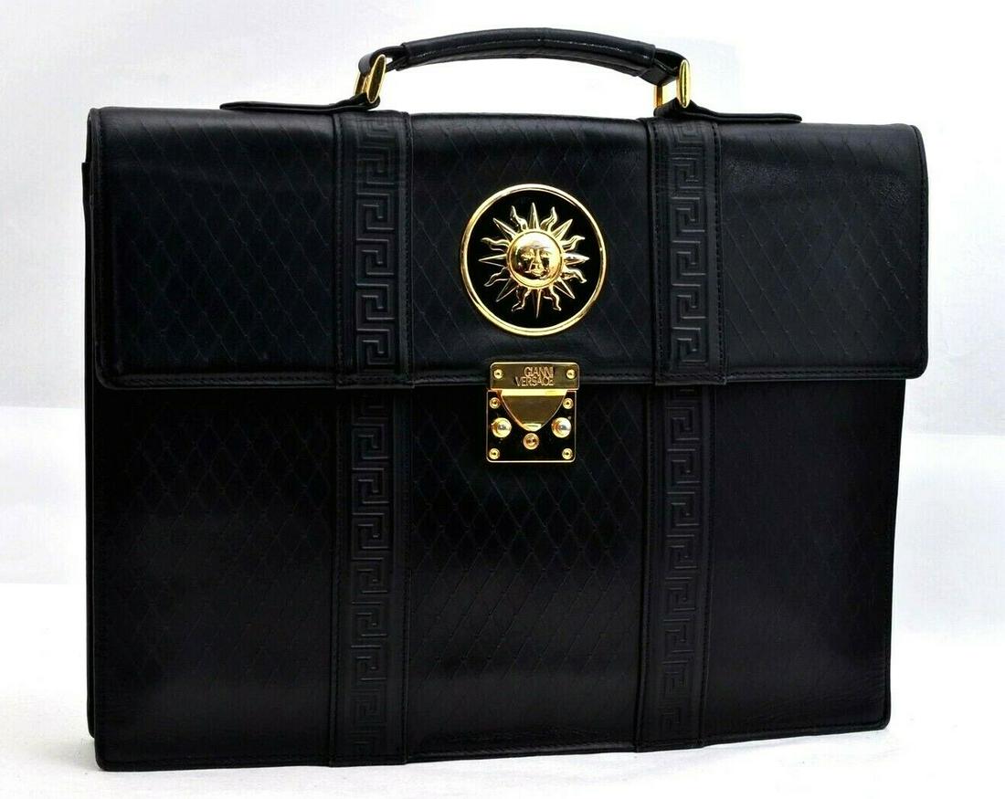 Authentic GIANNI VERSACE Brief Case: Brand: GIANNI VERSACE Model: Brief Case Country of Origin: Material: Leather Color: Black Bag Length: 15.4inches (39cm) Bag Height: 11.4inches (29cm) Bag Depth: 2inches (5cm) All Bidhaus items come wi