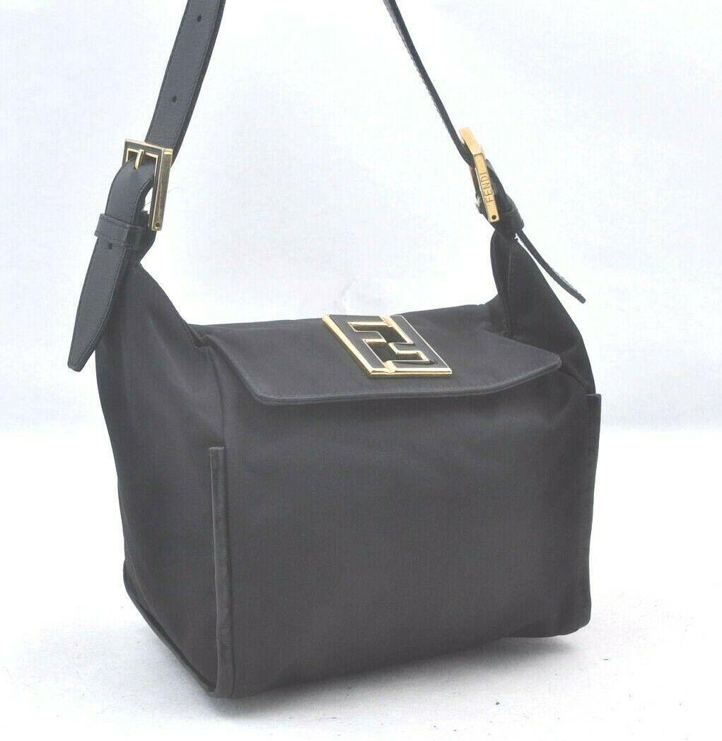 Authentic FENDI Hand Bag: Brand: FENDI Model: Hand Bag Country of Origin: Italy Material: Nylon Color: Black Bag Length: 7.7inches (19.5cm) Bag Height: 6.9inches (17.5cm) Bag Depth: 5.1inches (13cm) All Bidhaus items come with