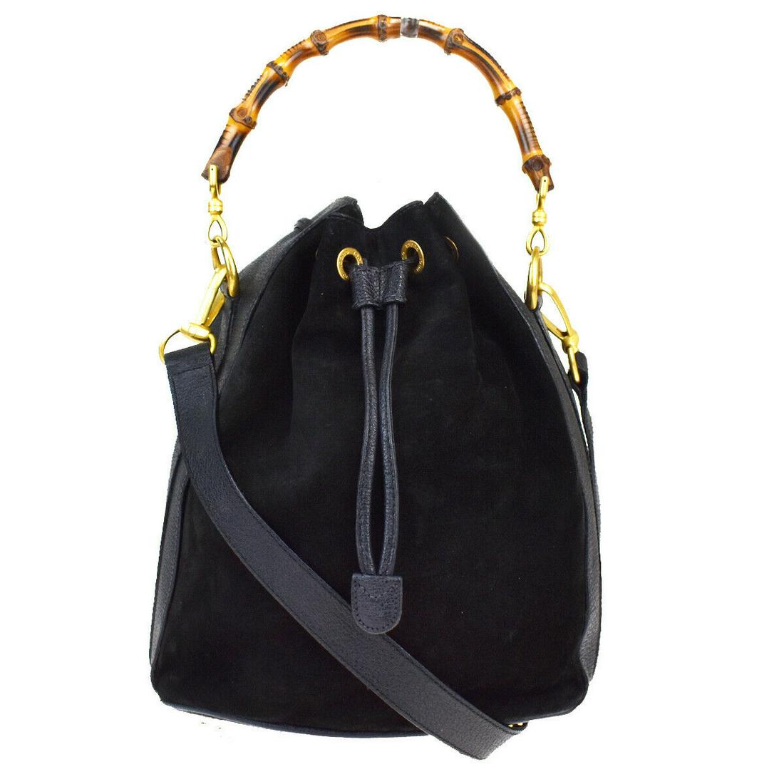 Authentic GUCCI Shoulder Hand Bag: Brand: GUCCI Model: Shoulder Hand Bag Country of Origin: Italy Material: Leather Color: Black Size (Inch): W9.1X H11.8X D6.3"Size (CM): W23X H30X D16Cm All Bidhaus items come with a 100 % money-back a