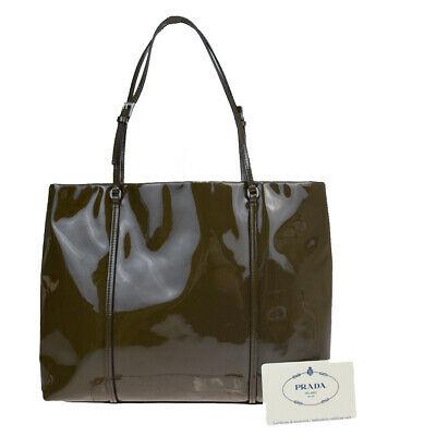 Authentic PRADA Handbag: Brand: PRADA Model: Handbag Country of Origin: Italy Material: Patent leather Color: Khaki Size: 21Cm X 25Cm X 6.5Cm / 8.26 X 9.84 X 2.55 Handle Drop 16Cm / 6.29 All Bidhaus items come with a 100 % mo