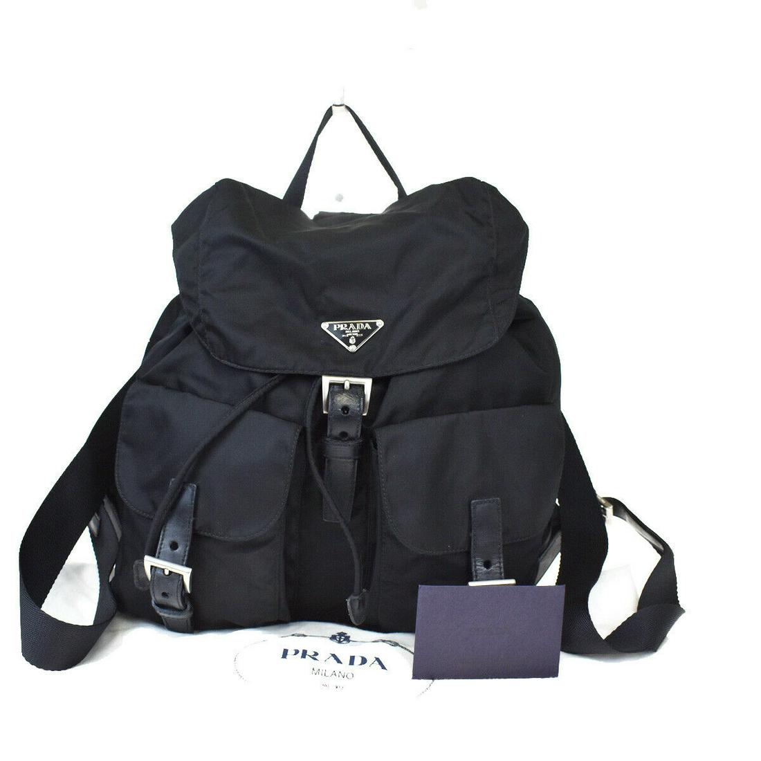 Authentic PRADA Backpack Style: Brand: PRADA Model: Backpack Style Country of Origin: Italy Material: Nylon Leather Color: Black Size (Inch): W11.8X H10.6X D5.1"Size (CM): W30X H27X D13Cm All Bidhaus items come with a 100 % money-ba