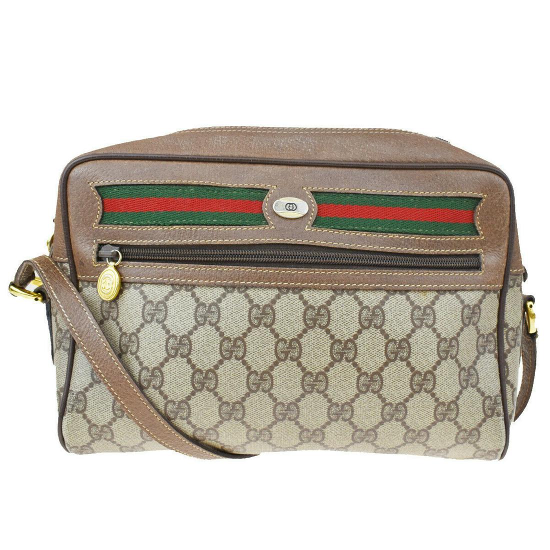 Authentic GUCCI Shoulder Bag: Brand: GUCCI Model: Shoulder Bag Country of Origin: Material: PVC Leather Color: Brown Size (Inch): W9.8X H7.1X D3.1"Size (CM): W25X H18X D8Cm All Bidhaus items come with a 100 % money-back authentici