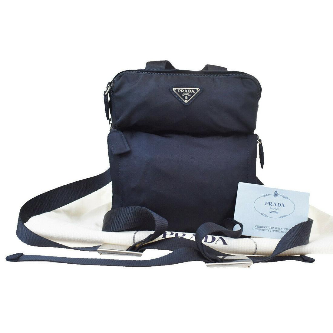 Authentic PRADA Backpack Bag: Brand: PRADA Model: Backpack Bag Country of Origin: Italy Material: Nylon Color: Navy Blue Size (Inch): W7.1X H8.3X D3.5"Size (CM): W18X H21X D9Cm All Bidhaus items come with a 100 % money-back authen