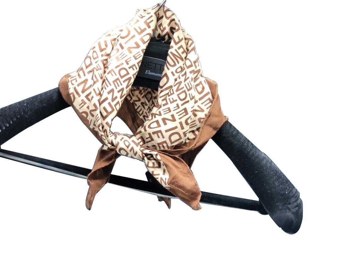Authentic Fendi Logo Scarf: Brand: Fendi Material: Cotton Style: Scarf Color: Light Brown/Dark Brown Size(inch): 18 x 18 Country of Origin: Japan Comments: Slightly wringled ends All Bidhaus items come with a 100% money-back aut