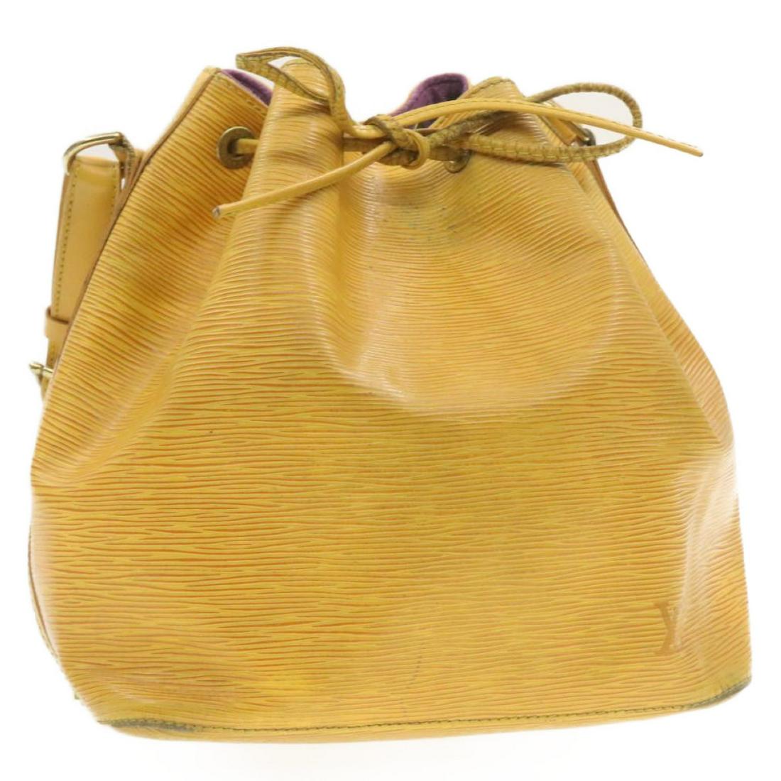 Authentic LOUIS VUITTON Epi Petit Noe Shoulder Bag: Brand: LOUIS VUITTON Style: Shoulder Bag Material: Epi Leather Color: Yellow Made In: France Size (Inches): W9.8 x H10.6 x D7.4"(Approx) Exterior Condition: Epi Leather : rubbing lose shape <