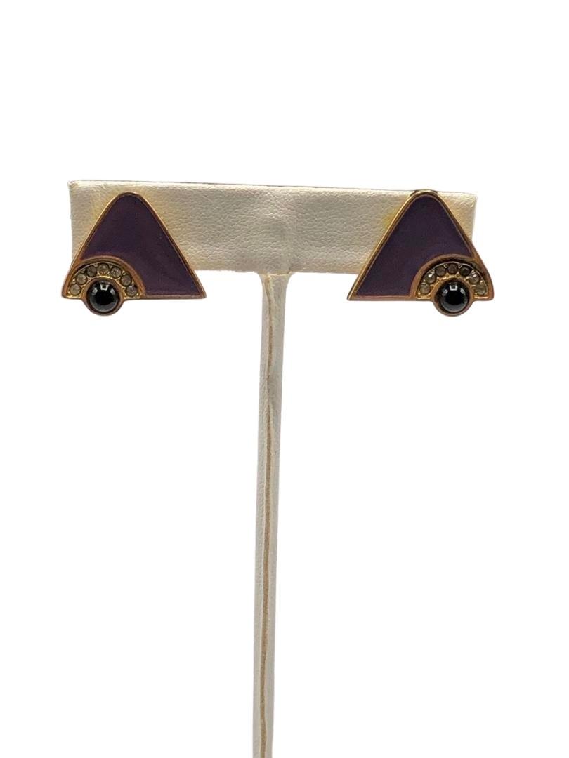 Authentic Givenchy Purple Enamel Triangle Earrings: Brand: Givenchy Material: Gold-plated Style: EarringsClip Hallmark: "Givenchy" Country of Origin: France All Bidhaus items come with a 100% money-back authenticity guarantee. ALL SALES ARE FINAL. Plea