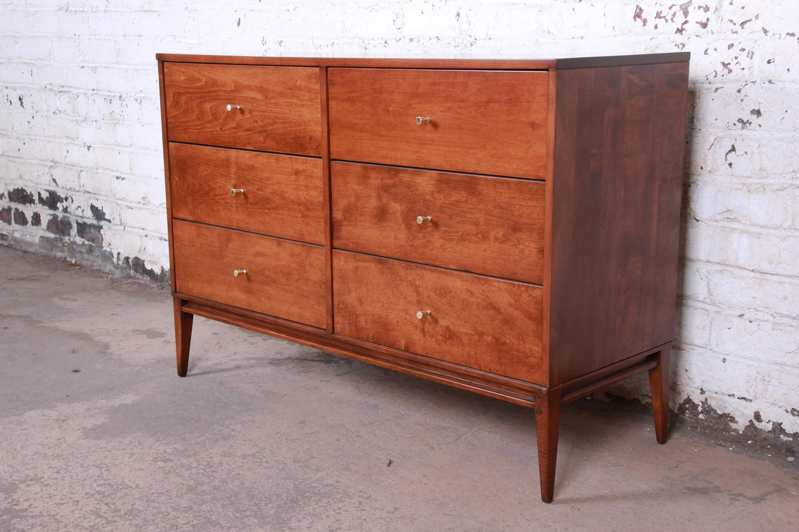 Authentic Paul McCobb Planner Group Mid-Century Modern: An exceptional mid-century modern six-drawer dresser or credenza Designed by Paul McCobb for Winchendon Furniture "Planner Group" USA 1950s Solid maple + brass hardware Measures: 48"W x 18"D x 33.25"H