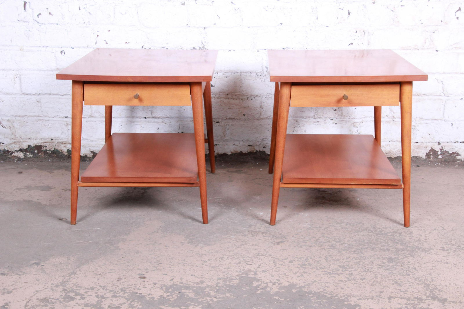 Authentic Paul McCobb Planner Group Mid-Century Modern: A gorgeous pair of mid-century modern nightstands or side tables designed by Paul McCobb for his Planner Group line for Winchendon Furniture. The tables feature solid maple construction with McCobb's