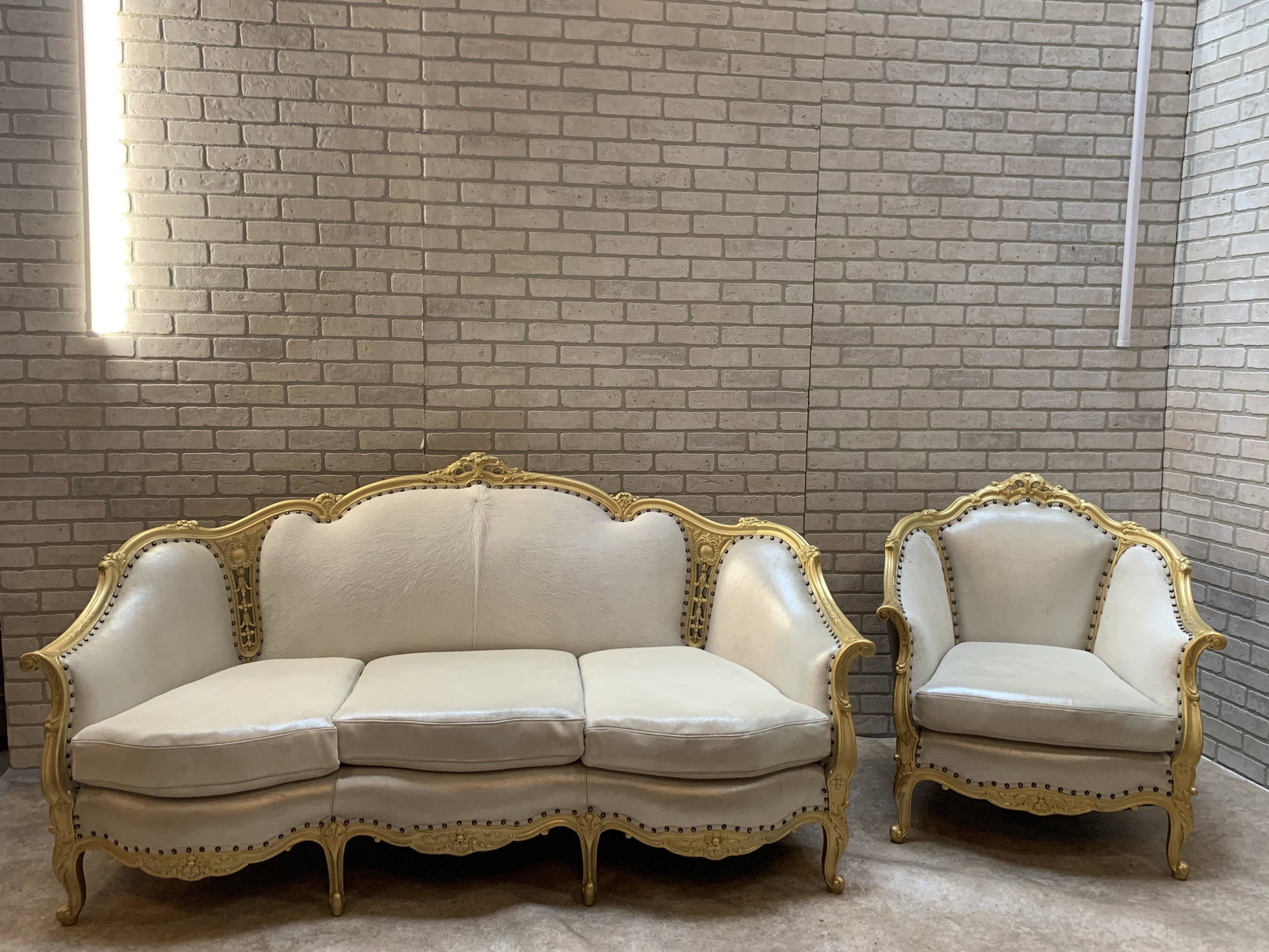 Antique Victorian Carved Sofa and Lounge Chair Newly: Antique Victorian Carved Sofa and Lounge Chair Newly Upholstered in High End Designer Holly Hunt Pearl Metallic Leather and Brazilian Cow Hide - 2 Piece Parlor Set Circa 1940 Chair W 37 D 33 H 37â€