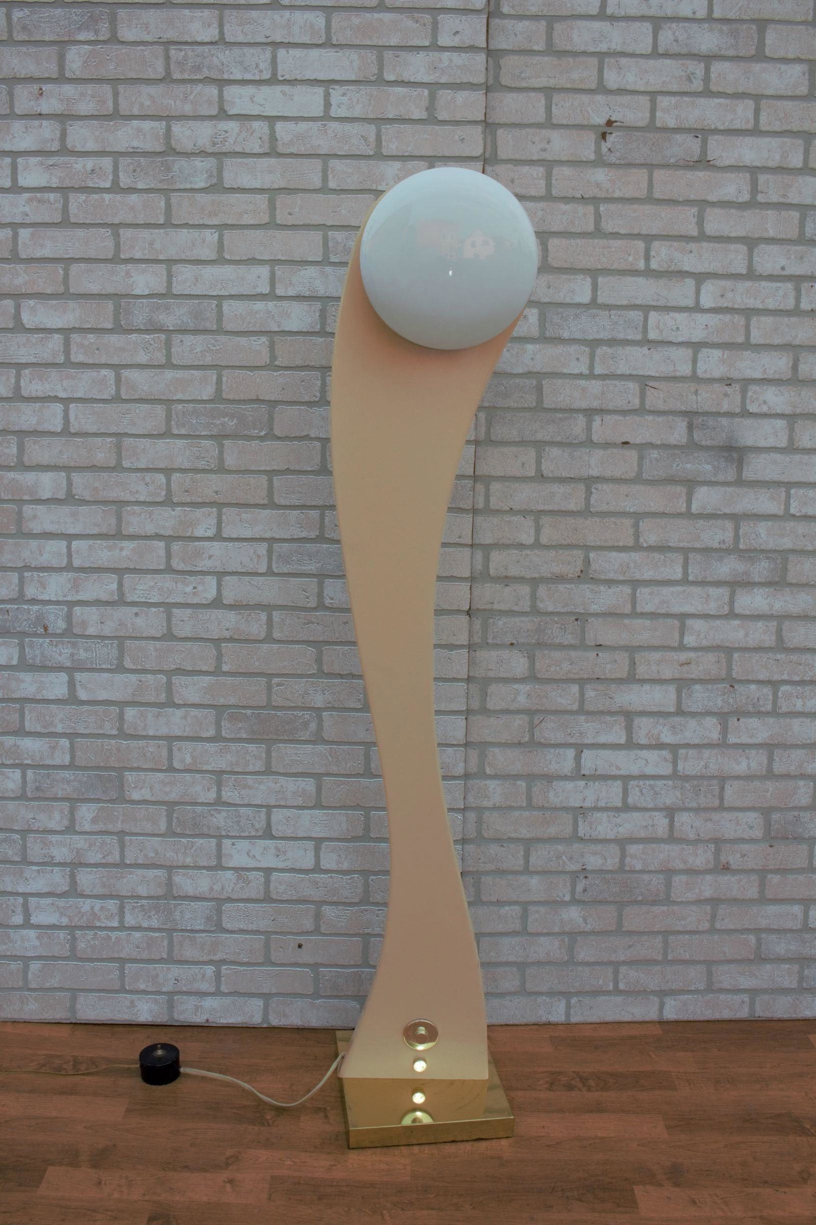 Art Deco Porcelain Floor Lamp With Two Glass Shades: Art Deco Porcelain Floor Lamp With Two Round and White Glass Shades and Three Lighting Options You can light just the back front or both. The base is a metal gold square and the body of the lamp swive
