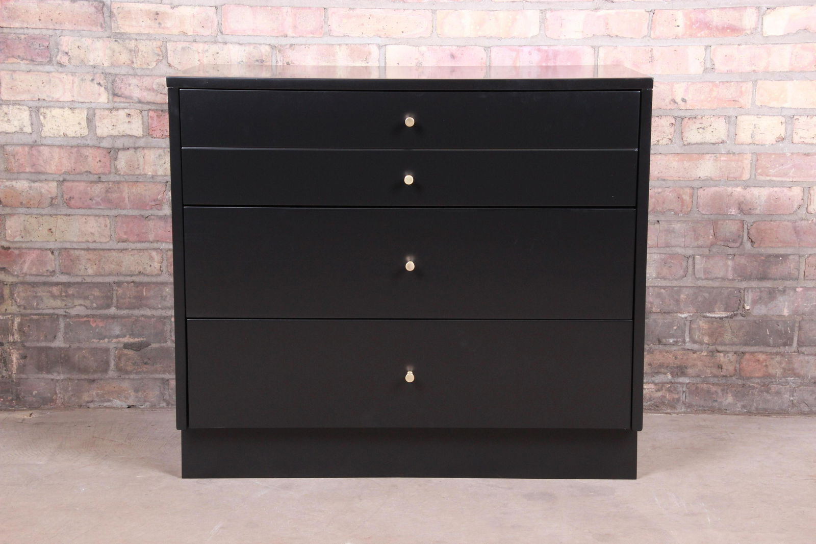 Authentic Paul McCobb Planner Group Black Lacquered: An exceptional mid-century modern three-drawer dresser chest By Paul McCobb for Winchendon Furniture "Planner Group" USA 1950s Black lacquered solid birch with original brass hardware. Measures: 32"W