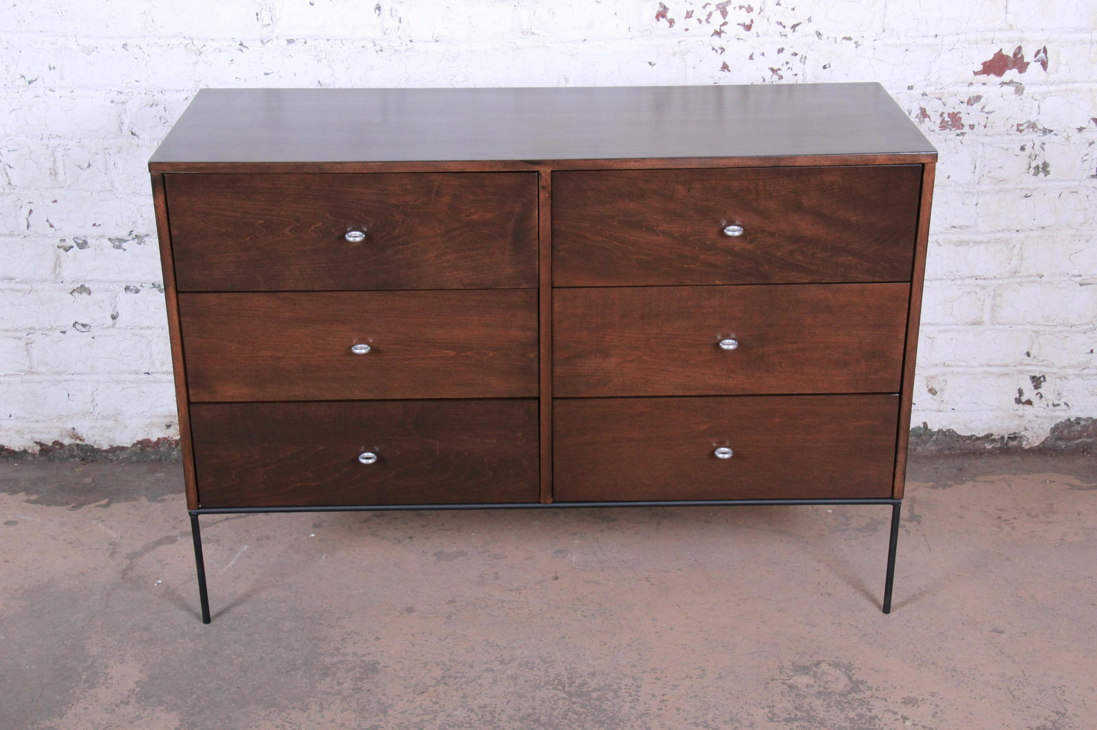 Authentic Paul McCobb Planner Group Iron Base: An exceptional mid-century modern six-drawer dresser or credenza from the Planner Group line designed by Paul McCobb for Winchendon Furniture. The dresser features solid maple construction with stunni
