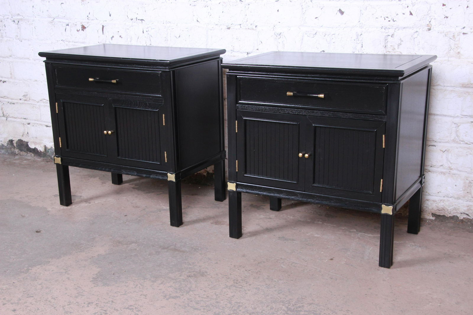 Authentic Tamerlane Collection Hollywood Regency: An exceptional pair of Hollywood Regency Chinoiserie nightstands or end tables from the Tamerlane Collection by Thomasville. The nightstands feature gorgeous walnut wood grain with a newly ebonized fi