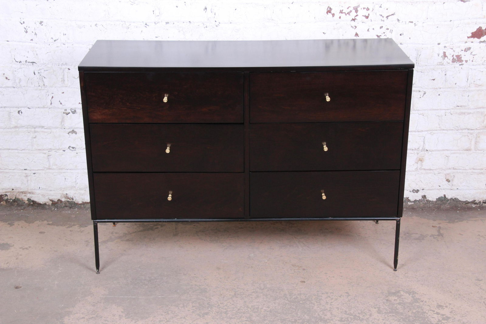 Authentic Paul McCobb Planner Group Iron Base Ebonized: An exceptional mid-century modern ebonized six-drawer double dresser or credenza By Paul McCobb for Winchendon Furniture "Planner Group" USA 1950s Newly ebonized solid birch + brass hardware + iron ba
