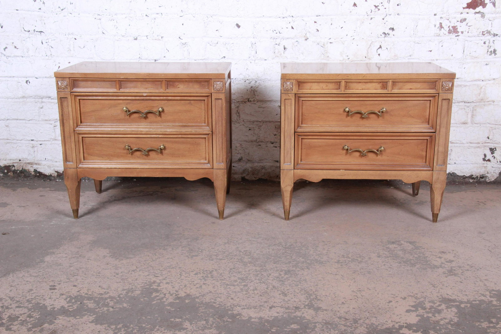 Authentic American of Martinsville Mid-Century Modern: A beautiful pair of mid-century modern Hollywood Regency nightstands By American of Martinsville USA 1960s Cherry + burl wood + brass hardware Measures: 25.13"W x 16"D x 23.25"H. Good original vintage