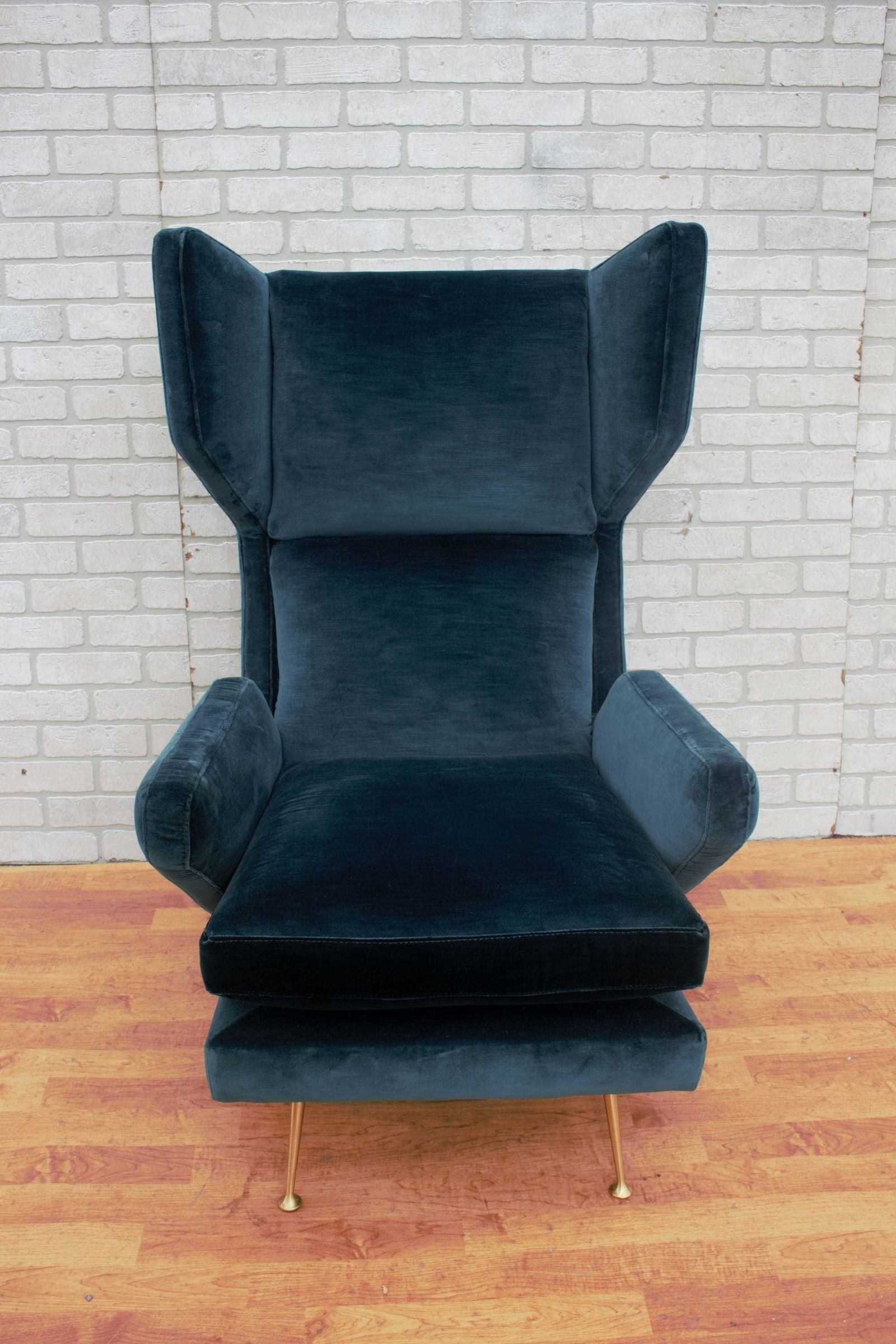 Mid Century Modern Italian Gio Ponti Style Wingback: Mid Century Modern Italian Gio Ponti Styled Wingback Lounge Chair Newly Upholstered in Emerald Green Plush Silk Velvet A beautifully sculpturally designed Italian wingback brass legged lounge chairs i