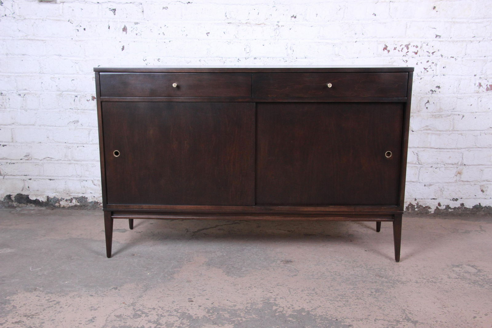 Authentic Paul McCobb Planner Group Sliding Door: Offering an exceptional mid-century modern sideboard credenza designed by Paul McCobb for his Planner Group line for Winchendon Furniture. The credenza features solid maple construction with stunning