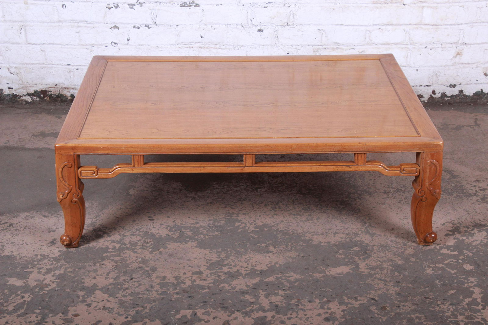 Authentic Michael Taylor for Baker Hollywood Regency: Mid-century modern Hollywood Regency Chinoiserie large coffee or cocktail table Designed by Michael Taylor for Baker Furniture USA Circa 1970s Elm wood with carved Asian details Measures: 50"W x 39.88