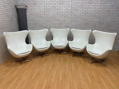 Mid Century Modern Arne Jacobsen Style Egg Chairs - Set: Mid Century Modern Arne Jacobsen Style Egg Chairs - Set of 5 Contact us for additional information. We can split up the chairs and/or custom upholster the chairs in your choice Circa 1970 H 44 W 33 D 
