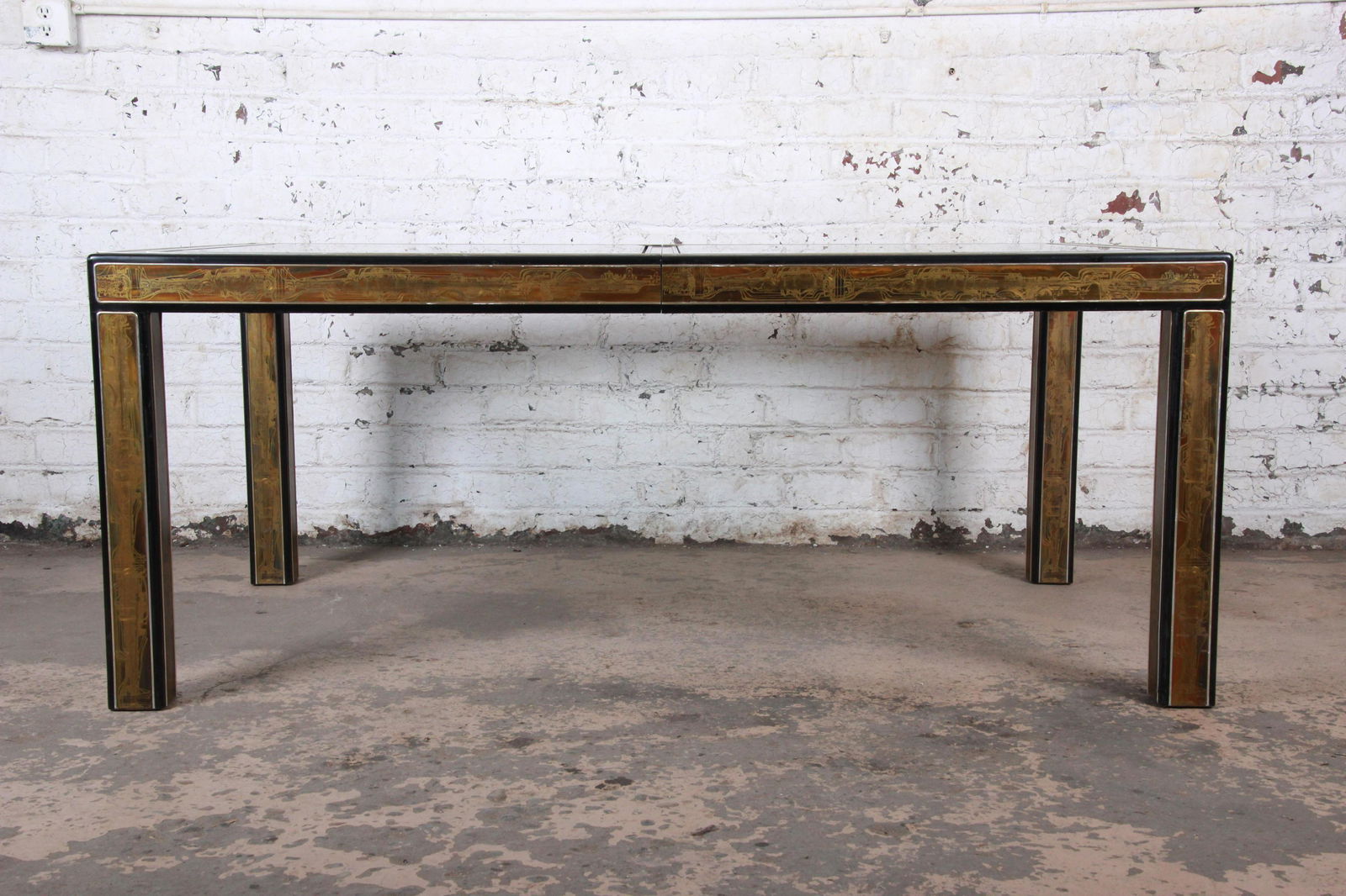 Authentic Bernhard Rohne for Mastercraft Acid Etched: A gorgeous mid-century modern Hollywood Regency acid etched extension dining table By Bernhard Rohne for Mastercraft USA 1970s Acid-etched brass + ebonized wood + beveled glass Measures: 71.25"W x 43.